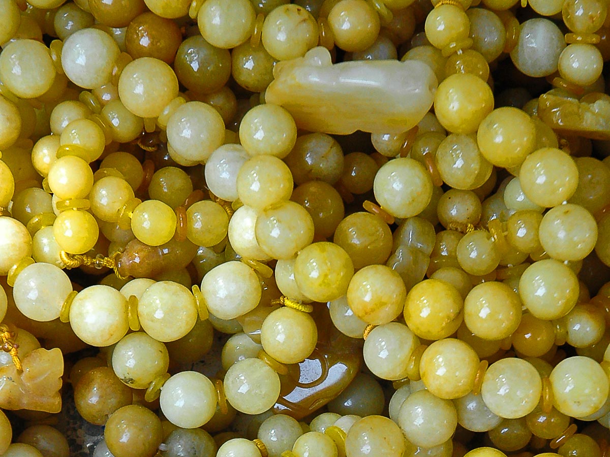 Gorgeous Yellow Jade Gemstone Found in Madagascar near the foothills and jungle Hand polished and set on an 18k gold snake 17” necklace.